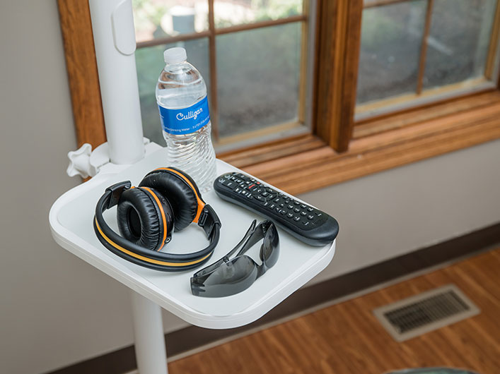 headphones headphones, remote, water bottle and glasses